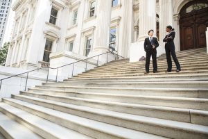 lawyers on courthouse steps - taking a personal injury case to trial